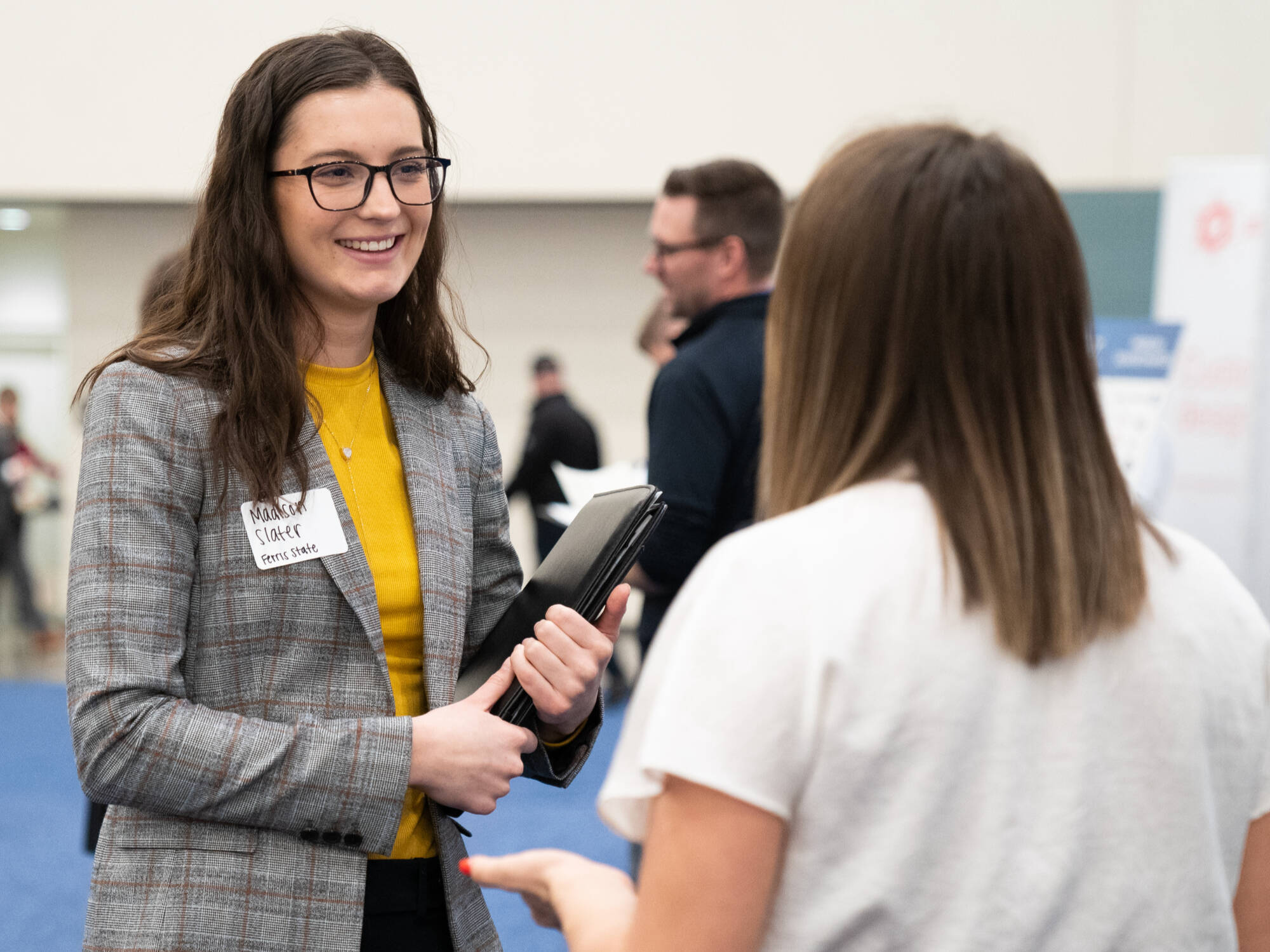 two people networking at the career fair